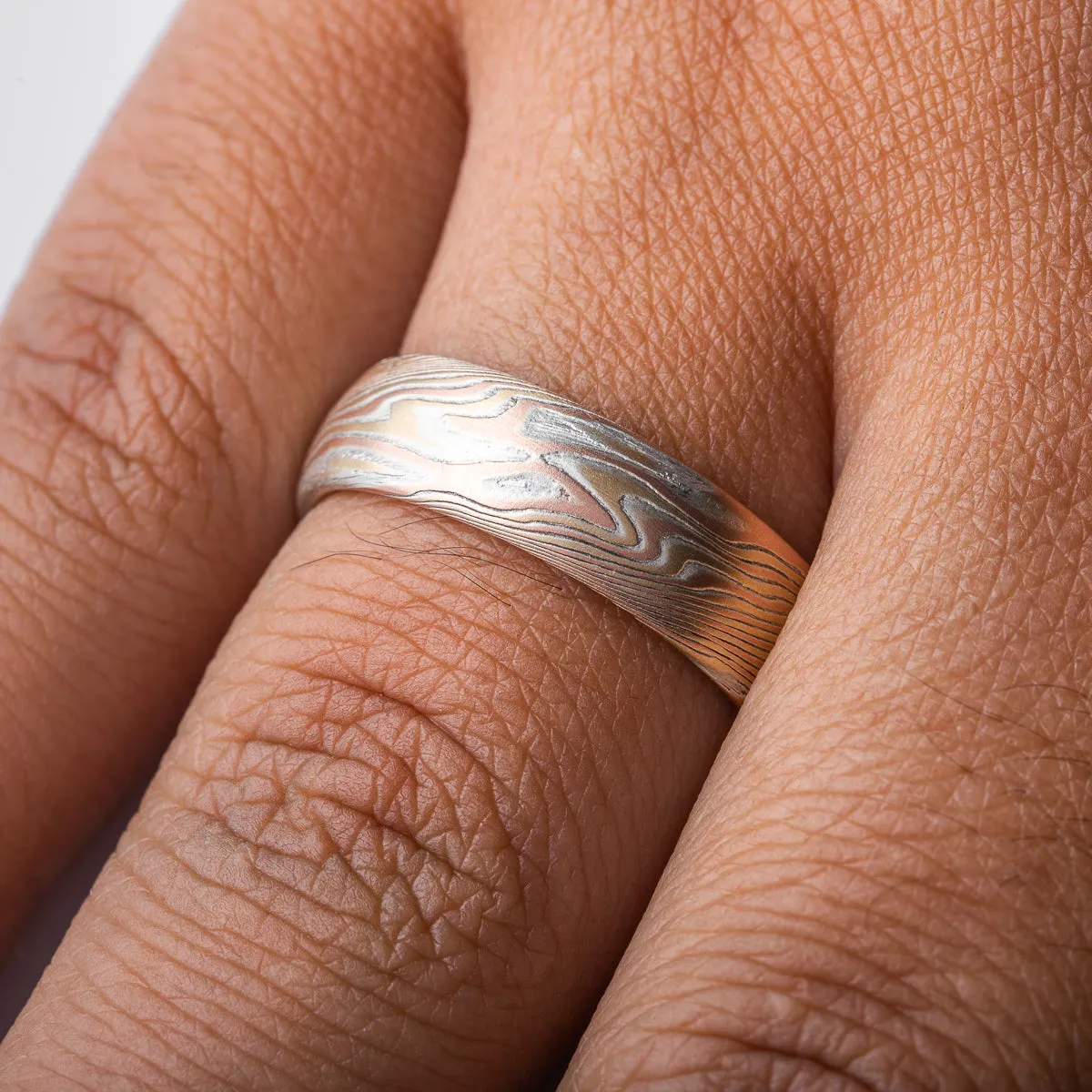 Elegant Mokume Ring in Twist Pattern and Fire Palette